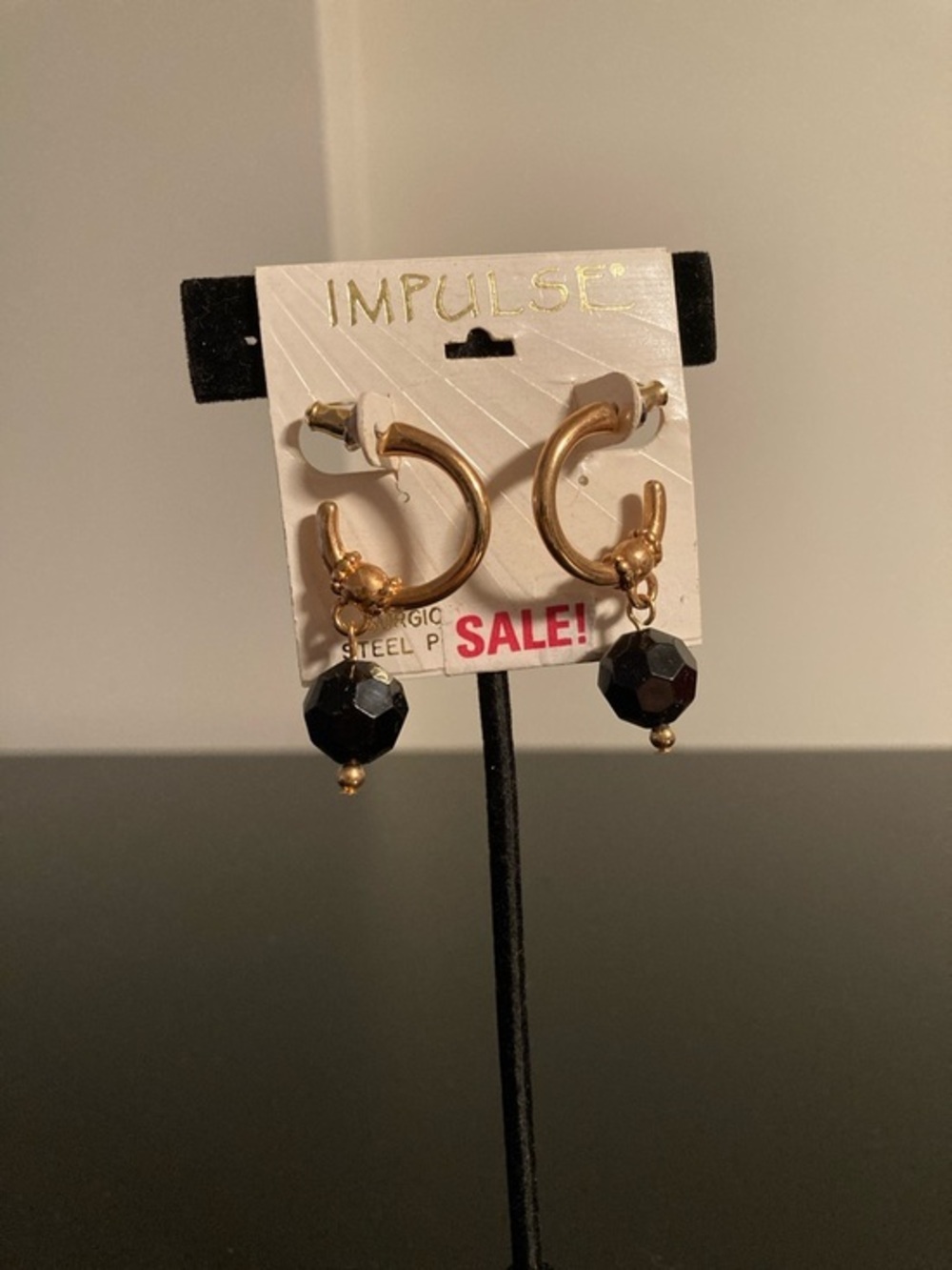 Impulse Gold Hoop Earrings with Black Faceted Drops